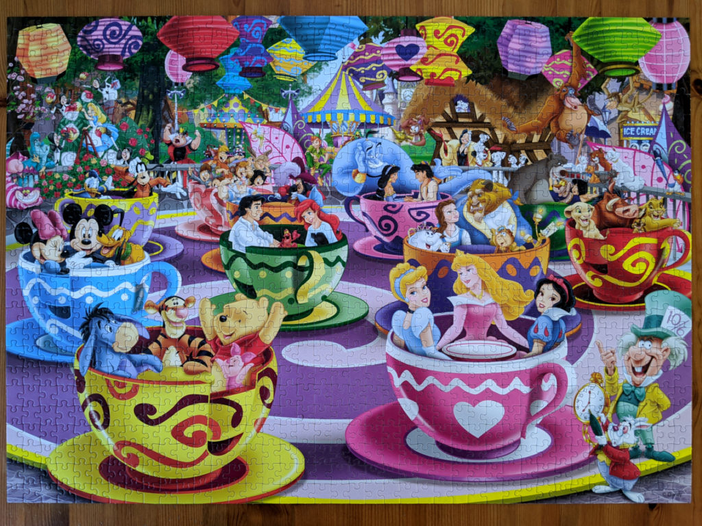 Disney characters riding Mad Tea Cup